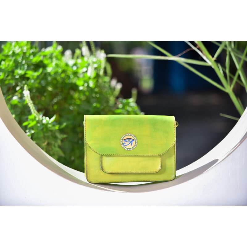 Eye of Horus Copper Charm on a Mint Greeen Cross Bag